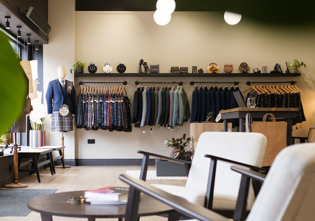 Sett Highlandwear collection with kilts and jackets on a clothing rail