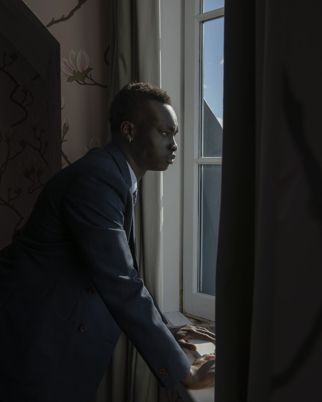 Man wearing a black tailored suit from Sett